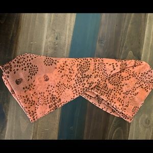Orange and brown skull infinity scarf.